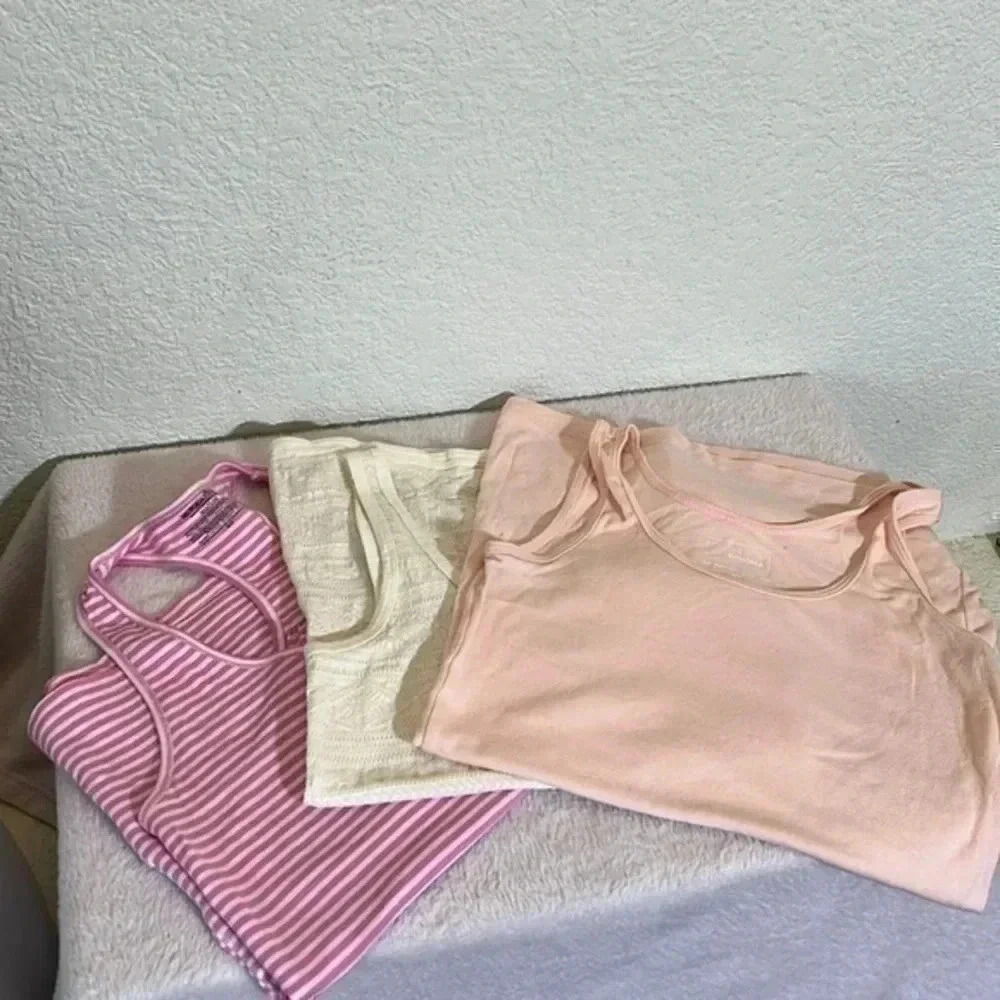 3 tank tops. 2 size small, 1 extra small